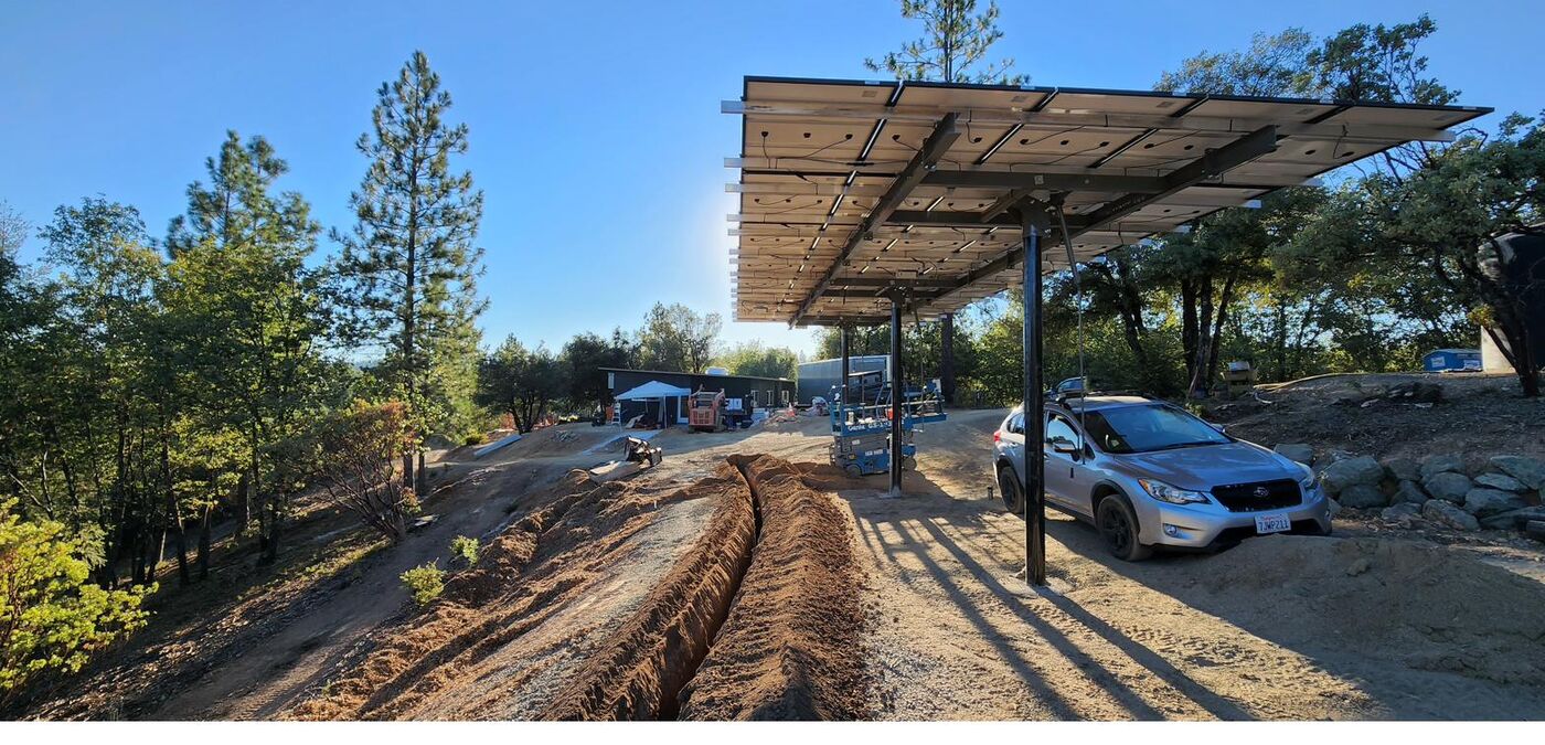 15 kilowatt tiltable solar carport with vehicle parked underneath