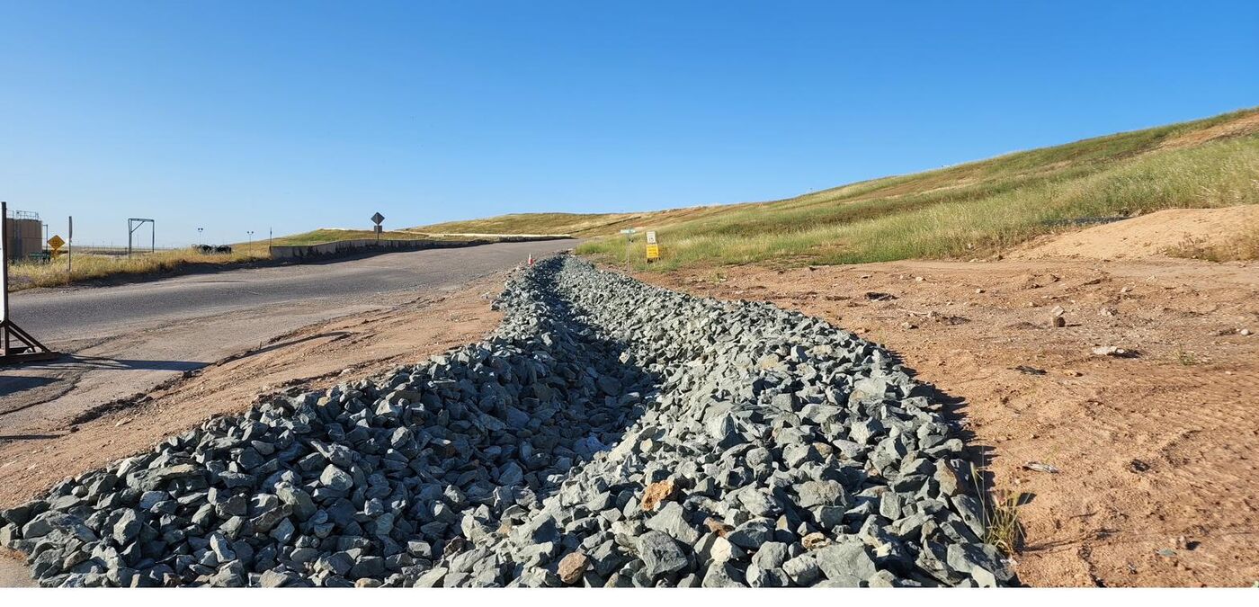 Riprap erosion control installed along a roadside drainage
